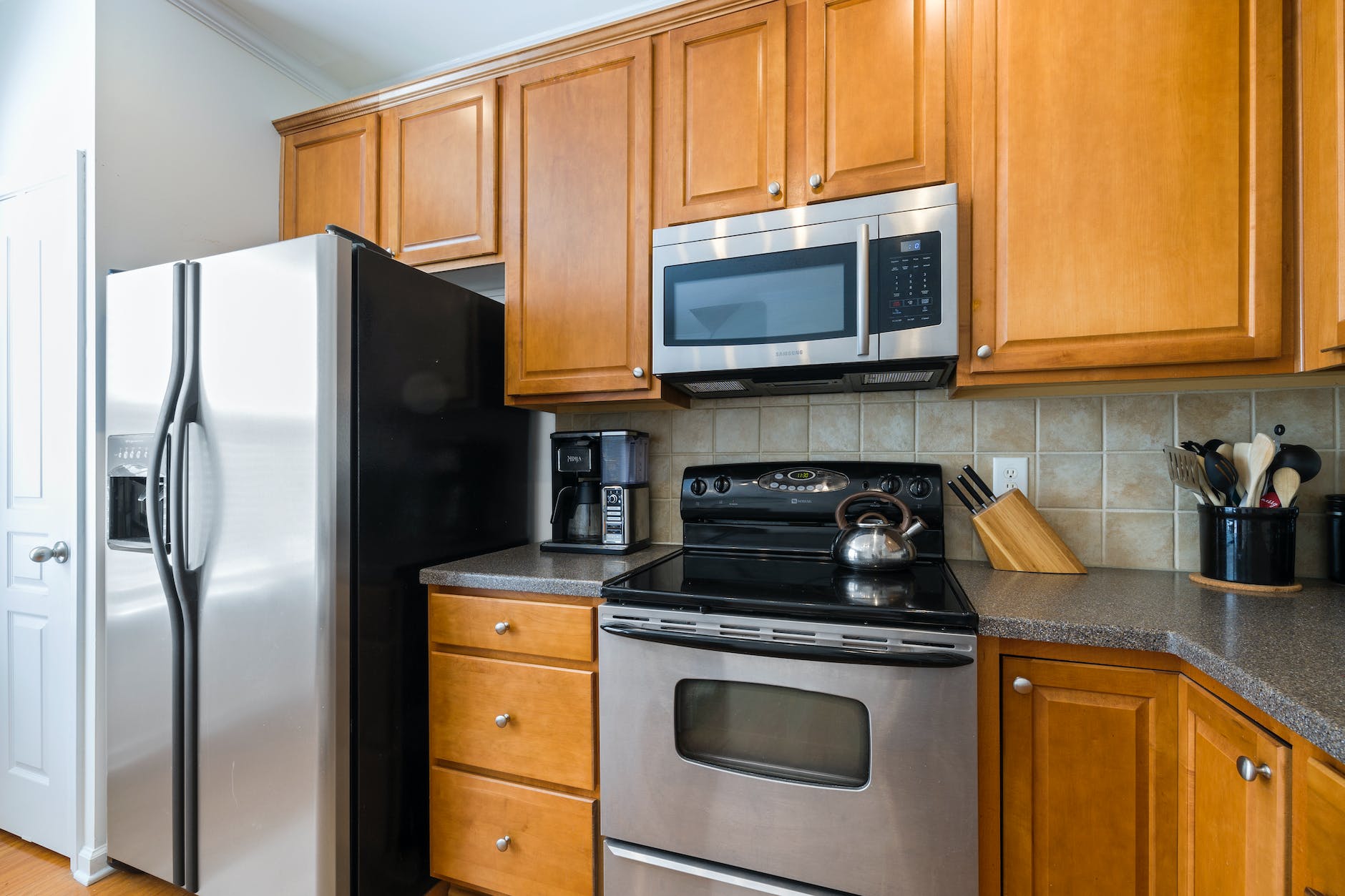 a kitchen with stainless steel appliances