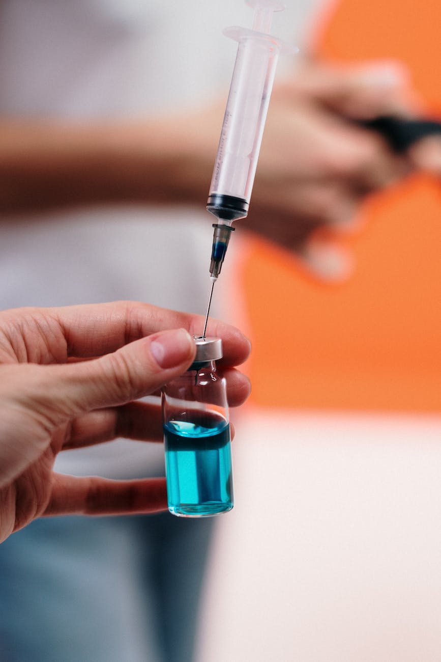 person holding a vaccine