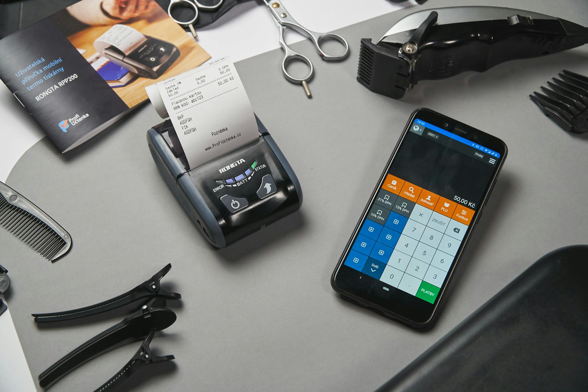 cash register and calculator on smartphone in barber shop