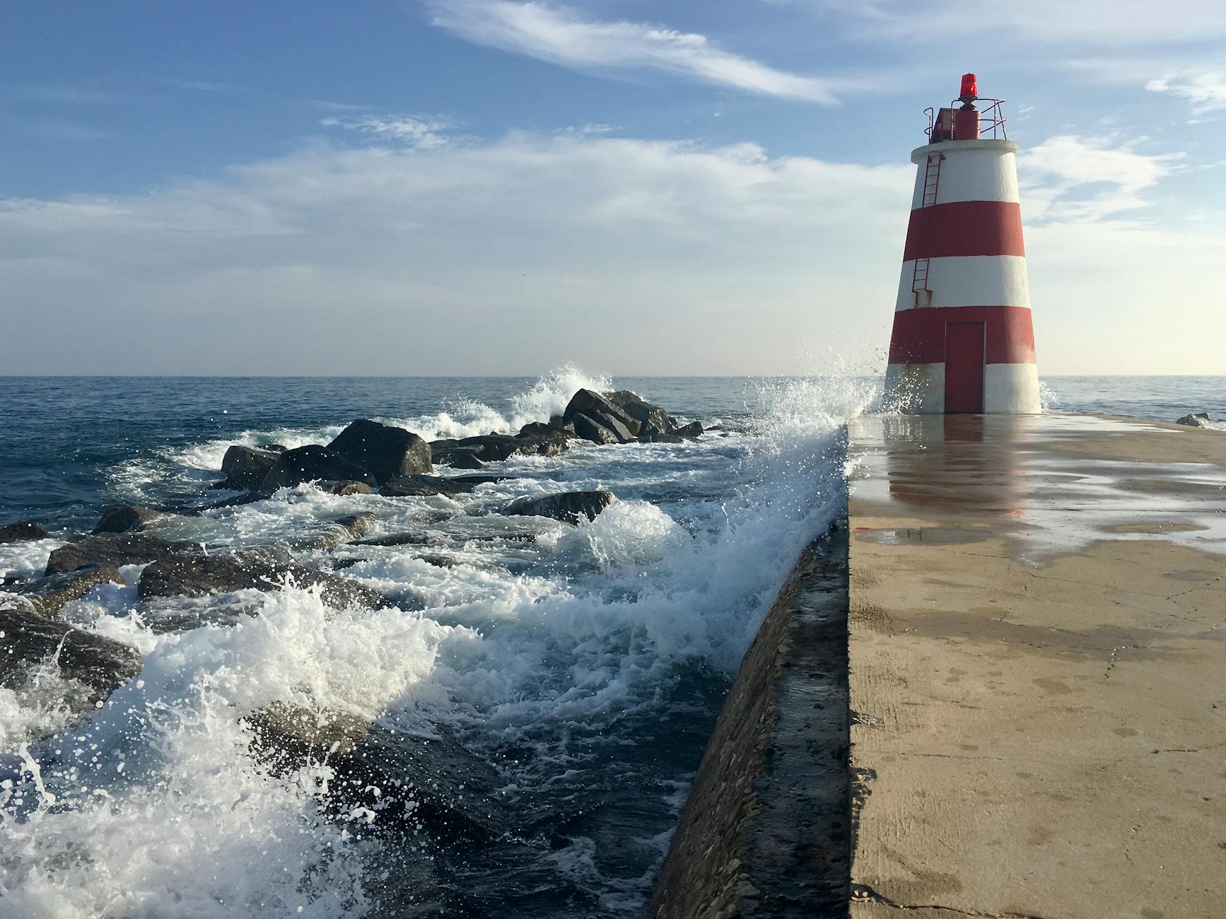 photo of red and white lighthouse