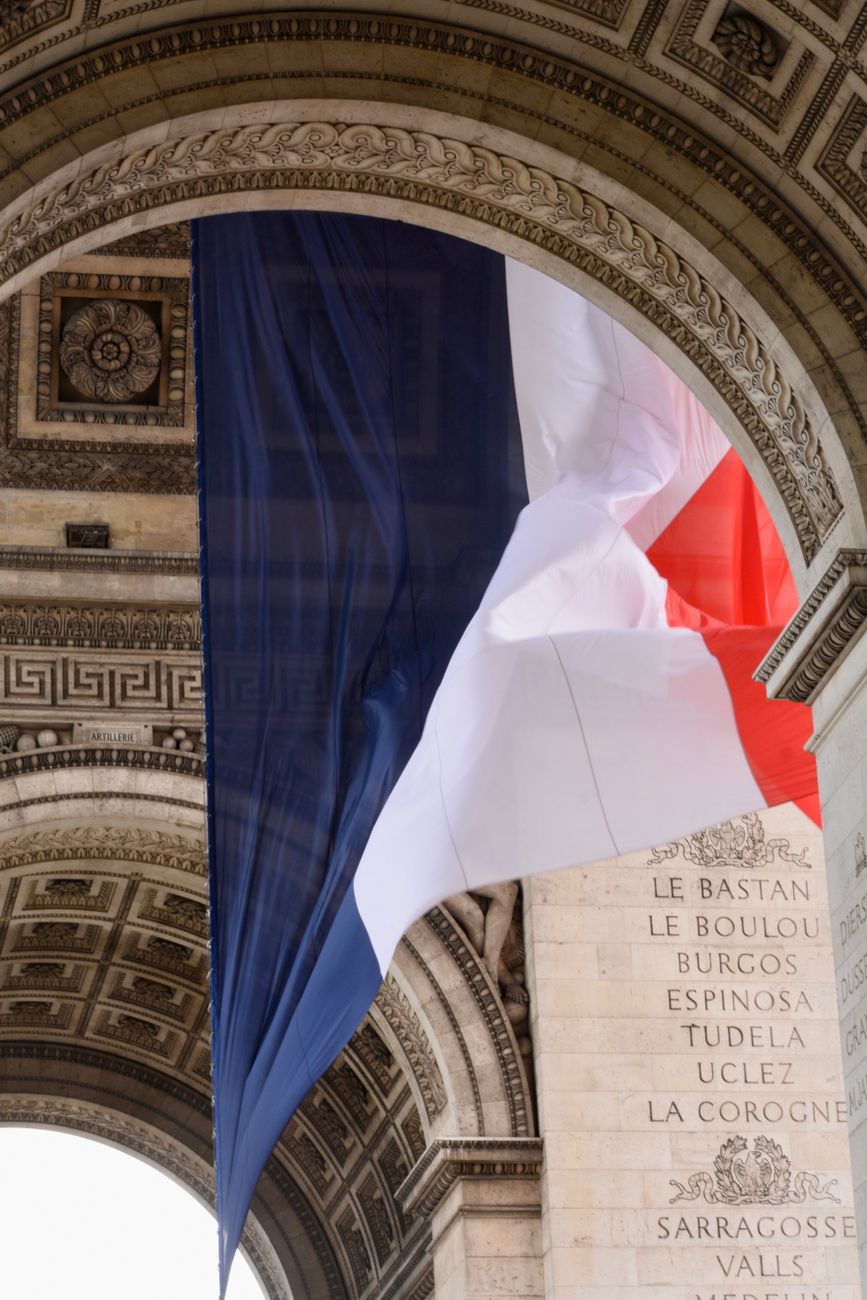 french flag hanging in arch
