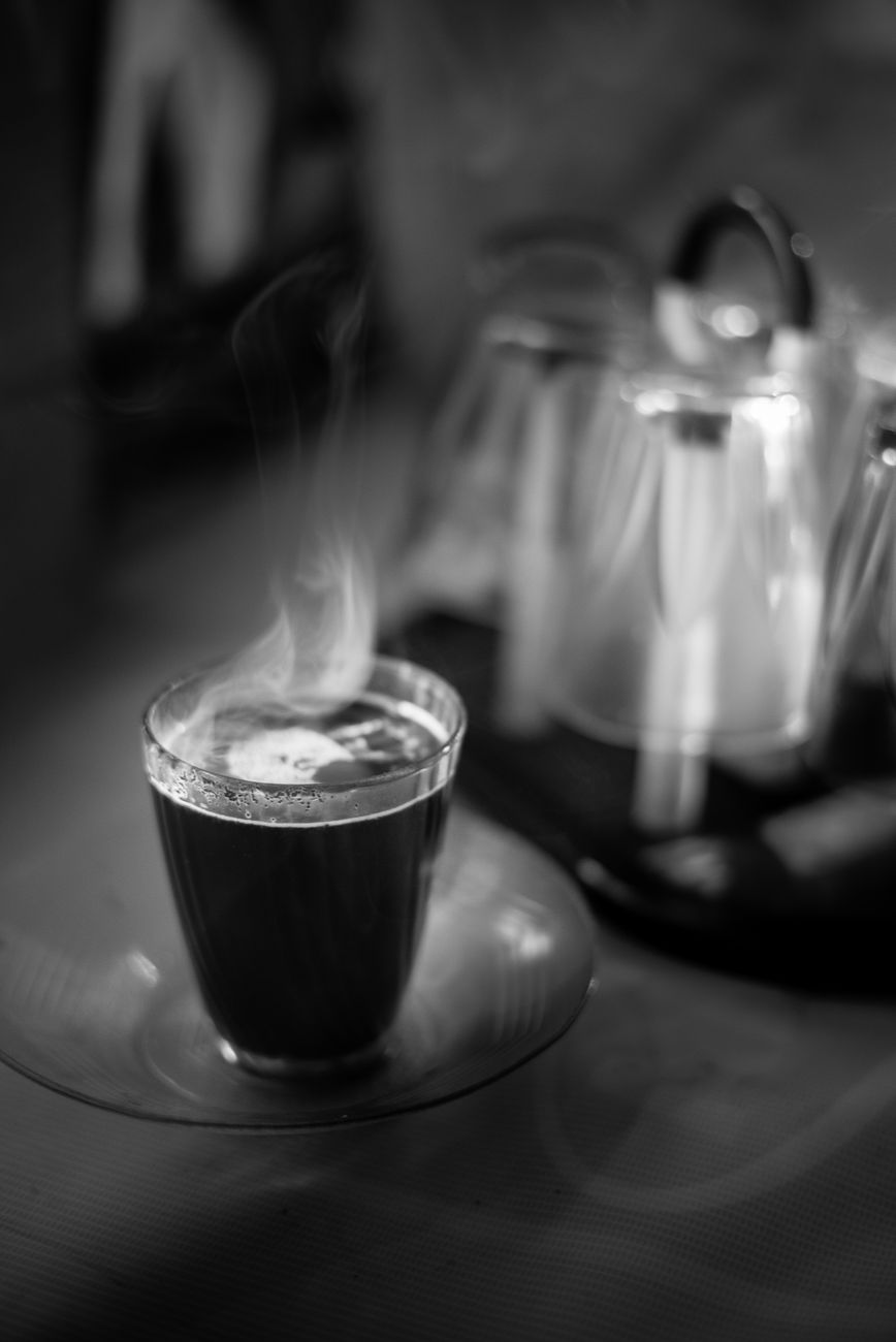 grayscale photo of a cup of coffee