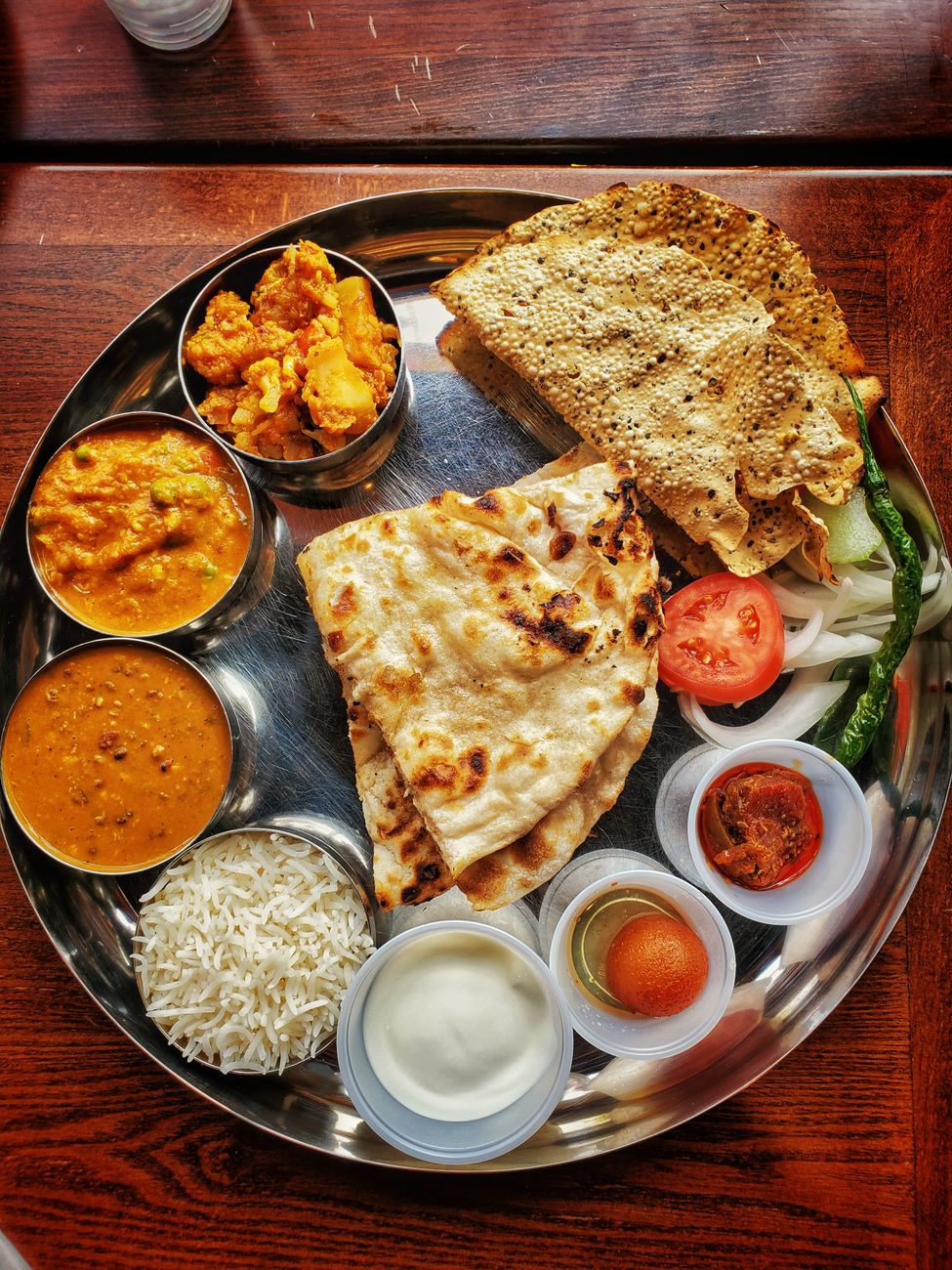 tray with tortillas and bowl with ingredients and dips